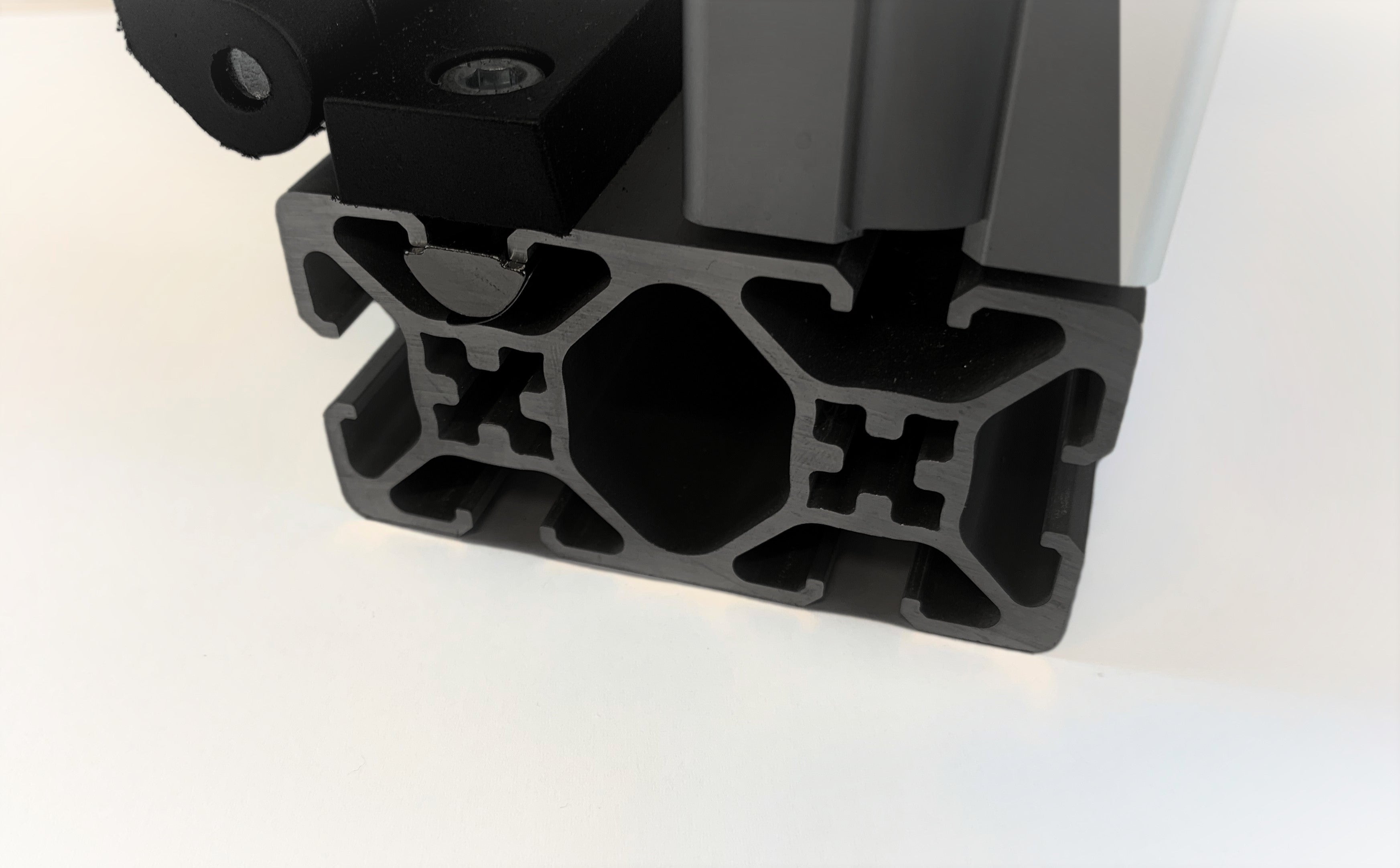 40 x 80 mm black anodised aluminium T-slot extrusion with corner bracket, ALEXCO New Zealand